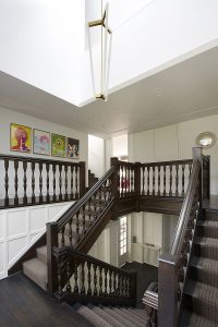 Arts-and-Crafts entrance hall with contemporary chandelier